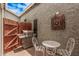 This outdoor patio features a grill, brickwork, and stylish metal furniture at 2929 E Broadway Rd # 30, Mesa, AZ 85204
