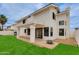 Large backyard with grass, patio, and desert landscaping. Great for outdoor activities at 3315 E Taro Ln, Phoenix, AZ 85050