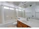 Bathroom featuring a large vanity, a tub and a window at 3315 E Taro Ln, Phoenix, AZ 85050