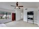 Bright bedroom with a ceiling fan, large window, and media center at 3315 E Taro Ln, Phoenix, AZ 85050