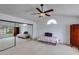 Bright bedroom with mirrored closet doors, ceiling fan, and plenty of natural light at 3315 E Taro Ln, Phoenix, AZ 85050