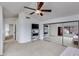 Spacious bedroom with a ceiling fan, mirrored closet doors, and a view of the outside at 3315 E Taro Ln, Phoenix, AZ 85050
