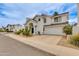 A home with desert landscaping, arched entryway, a round window and attached garage at 3315 E Taro Ln, Phoenix, AZ 85050