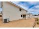 Back of a two-story stucco house with a covered patio and a gravel backyard at 3315 E Taro Ln, Phoenix, AZ 85050