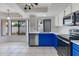 Well-lit kitchen with stainless steel appliances, white countertops, and a view of the backyard at 3315 E Taro Ln, Phoenix, AZ 85050