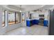 Bright eat-in kitchen features white cabinets, stainless appliances, tile floors and views of the private backyard at 3315 E Taro Ln, Phoenix, AZ 85050