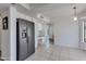 Bright kitchen with stainless steel appliances, white cabinets, and an adjacent breakfast nook at 3315 E Taro Ln, Phoenix, AZ 85050
