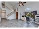 A bright living room area with tile floors, a staircase, and vaulted ceilings at 3315 E Taro Ln, Phoenix, AZ 85050