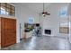 A living room featuring tile floors, bright white walls, a fireplace and many windows at 3315 E Taro Ln, Phoenix, AZ 85050