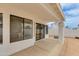 Covered patio with textured concrete pad and view of a block wall in the backyard at 3315 E Taro Ln, Phoenix, AZ 85050