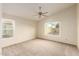 Spacious bedroom featuring vaulted ceilings, a ceiling fan, and bright windows at 3443 E Wickieup Ln, Phoenix, AZ 85050