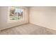 Bedroom with natural light from a large window overlooking the front yard at 3443 E Wickieup Ln, Phoenix, AZ 85050