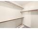 Walk-in closet with built in shelving ready for storage and organization at 3443 E Wickieup Ln, Phoenix, AZ 85050