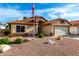 Charming single-story home boasts a desert landscape, neutral stucco, and a tile roof in a well-maintained neighborhood at 3443 E Wickieup Ln, Phoenix, AZ 85050