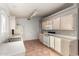 Cozy kitchen with ample counter space, white appliances, and tile flooring at 3443 E Wickieup Ln, Phoenix, AZ 85050