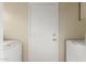 Laundry room featuring a washer and dryer next to a door to the backyard at 3443 E Wickieup Ln, Phoenix, AZ 85050