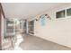 Enclosed patio area with tile floor, offering a comfortable outdoor space at 3443 E Wickieup Ln, Phoenix, AZ 85050