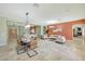 Spacious and inviting living area featuring stylish furniture and tile flooring at 3531 E Norwood Cir, Mesa, AZ 85213