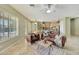 Warm and inviting living room connecting to the kitchen with cozy seating and natural light at 3531 E Norwood Cir, Mesa, AZ 85213