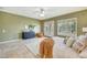 Bright and airy main bedroom boasts French doors, shutters, and a luxurious en-suite bathroom, providing ultimate comfort at 3531 E Norwood Cir, Mesa, AZ 85213