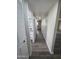 The hallway has wood floors and leads to other rooms in the house, including the kitchen at 3849 W Mauna Loa Ln, Phoenix, AZ 85053