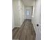 Hallway area with lots of storage cabinets and access to the laundry room at 3849 W Mauna Loa Ln, Phoenix, AZ 85053
