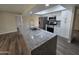 Bright kitchen with granite counters, stainless appliances, and a skylight for natural light at 3849 W Mauna Loa Ln, Phoenix, AZ 85053