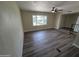 Open living room featuring a large window and neutral paint at 3849 W Mauna Loa Ln, Phoenix, AZ 85053