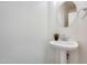 Half bathroom with pedestal sink, and modern fixtures at 4041 W Hackamore Dr, Phoenix, AZ 85083