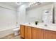 Bathroom with double vanity, mirror, and shower at 4041 W Hackamore Dr, Phoenix, AZ 85083