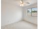 Bright bedroom featuring a ceiling fan and natural light from the large window at 4041 W Hackamore Dr, Phoenix, AZ 85083