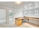 Bonus room featuring built-in desk with counter, storage and track lighting at 4041 W Hackamore Dr, Phoenix, AZ 85083