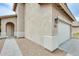 Home exterior featuring a two-car garage, neutral stucco, and well-maintained landscaping at 4041 W Hackamore Dr, Phoenix, AZ 85083