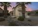 Inviting two-story home with mature palm trees and well-maintained desert landscaping at 4041 W Hackamore Dr, Phoenix, AZ 85083