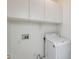 Laundry room with washer, overhead cabinets, and laundry hook-ups at 4041 W Hackamore Dr, Phoenix, AZ 85083