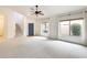 Bright living room with large windows, a staircase, and a blue entry door at 4041 W Hackamore Dr, Phoenix, AZ 85083