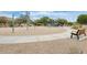 Community playground area featuring swings, slides, and a shaded seating area with benches at 4041 W Hackamore Dr, Phoenix, AZ 85083