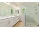 Bright bathroom features a double sink vanity, a walk-in shower with glass doors, and recessed lights at 4236 N 27Th St # 37, Phoenix, AZ 85016