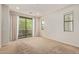 Spacious bedroom offering ample natural light and a sliding glass door to the balcony at 4236 N 27Th St # 37, Phoenix, AZ 85016