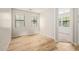 The empty bedroom offers two windows for natural light and light wood floors at 4236 N 27Th St # 37, Phoenix, AZ 85016