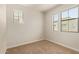 Bright bedroom with neutral carpet and two large windows that provide ample natural light at 4236 N 27Th St # 37, Phoenix, AZ 85016