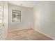 Neutral bedroom featuring carpet flooring, a large window, and white walls, creating a bright and airy space at 4236 N 27Th St # 37, Phoenix, AZ 85016