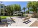 Serene outdoor common area featuring shaded seating and lush landscaping for community enjoyment at 4236 N 27Th St # 37, Phoenix, AZ 85016