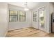 Bright dining area with ample natural light, wood flooring, and modern light fixture at 4236 N 27Th St # 37, Phoenix, AZ 85016