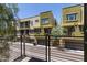 View of contemporary townhome exteriors, each with a private balcony and garage, on a sunny day at 4236 N 27Th St # 37, Phoenix, AZ 85016