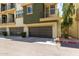 Exterior view of the garages of modern townhomes with decorative accents and convenient parking at 4236 N 27Th St # 37, Phoenix, AZ 85016