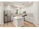 Beautiful kitchen features white cabinets, stainless steel appliances, and a center island with countertops at 4236 N 27Th St # 37, Phoenix, AZ 85016