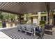 Community outdoor kitchen and dining area with a built-in grill and comfortable seating under a pergola at 4236 N 27Th St # 37, Phoenix, AZ 85016