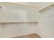 Walk-in closet with ample shelving and wood rods, providing great storage space at 4236 N 27Th St # 37, Phoenix, AZ 85016