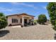 Inviting backyard patio with stone gravel, desert landscaping and covered patio of the house at 4332 E Cassia Ln, Gilbert, AZ 85298